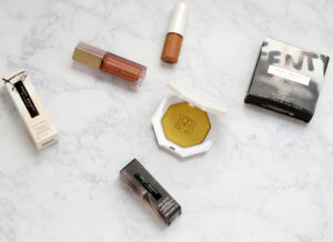 Fenty Beauty Pro Filt'r Soft Matte Longwear Foundation, Killawatt Freestyle Highlighter in Trophy Wife, and Gloss Bomb Universal Lip Luminizer