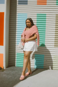 Valentine’s Day Outfit Inspiration: Pink cable knit cardigan and bralet set from River Island, white pleated tennis skirt, Gucci Woman’s rubber slide sandal